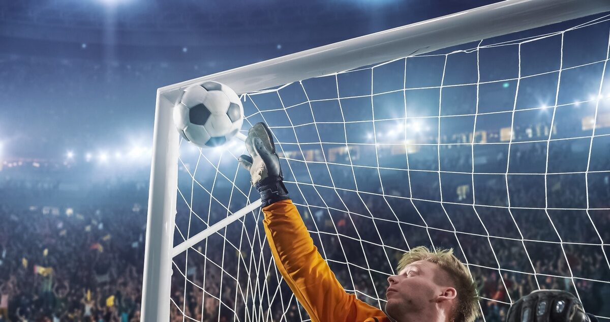 Soccer goalkeeper in action on the stadium