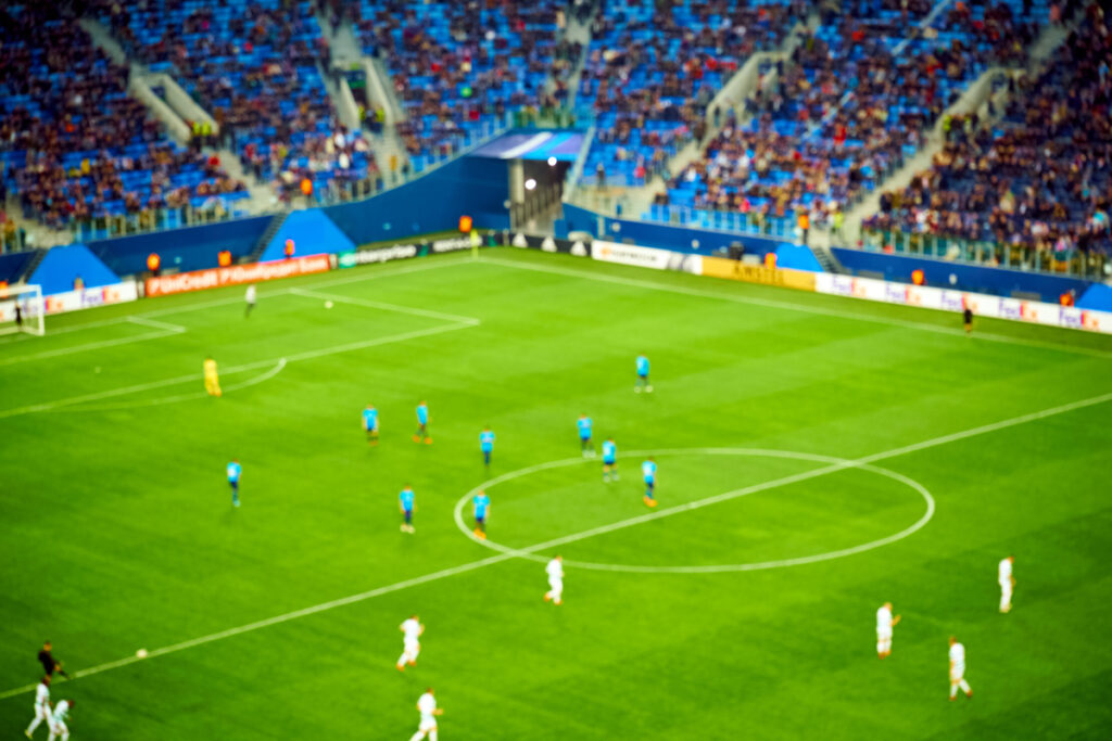 blurred soccer game view from tribunes