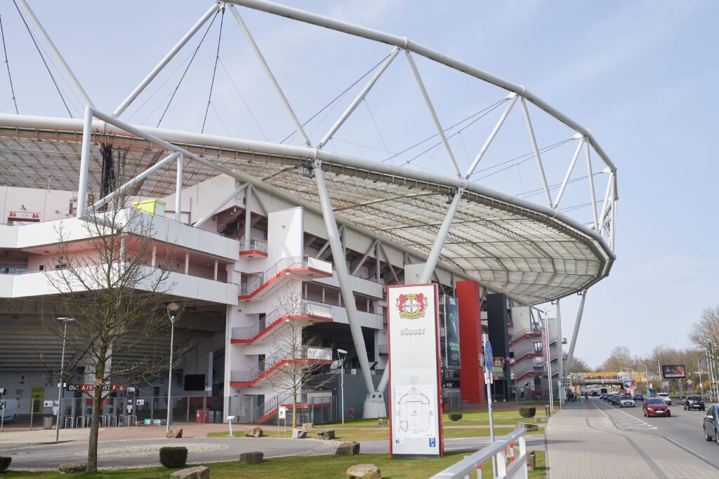 Exterior view of BayArena, showcasing its modern architecture and distinctive roof structure.