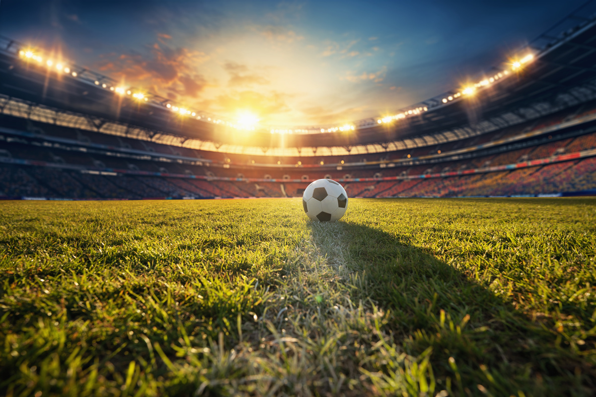 ball on the green field in soccer stadium