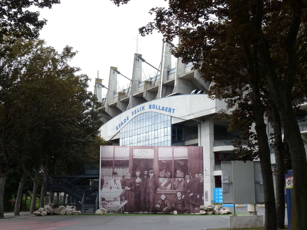 Exterior view of Stade Félix Bollaert-Delelis in Lens, France, with the stadium's name prominently displayed above the entrance.