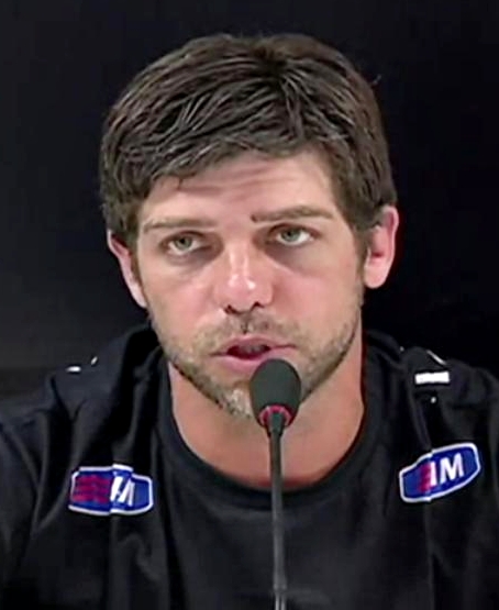 Juninho Pernambucano talking to a microphone