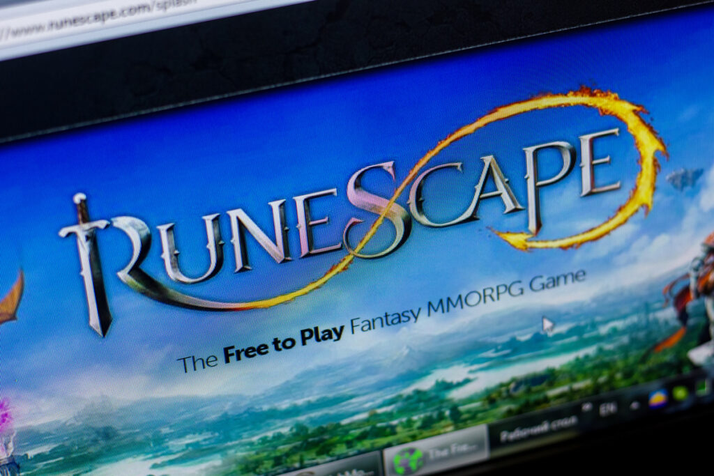 Homepage of RuneScape website on the display of PC, url - RuneScape.com