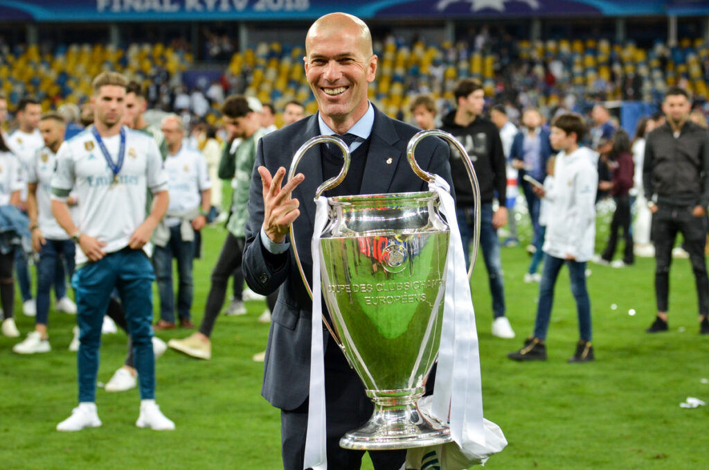 Zinedine Zidane holding the UEFA Champions League trophy