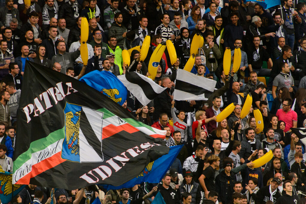 Football fans holding bananas