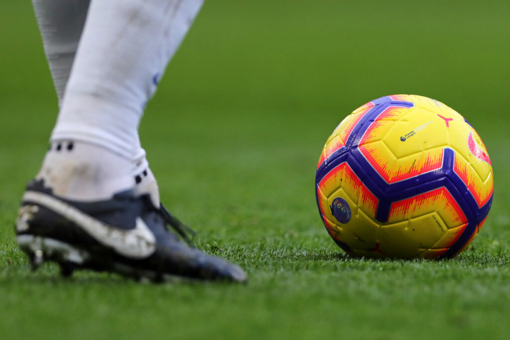 Official Nike Premier League ball in rainbow colours on a stadium