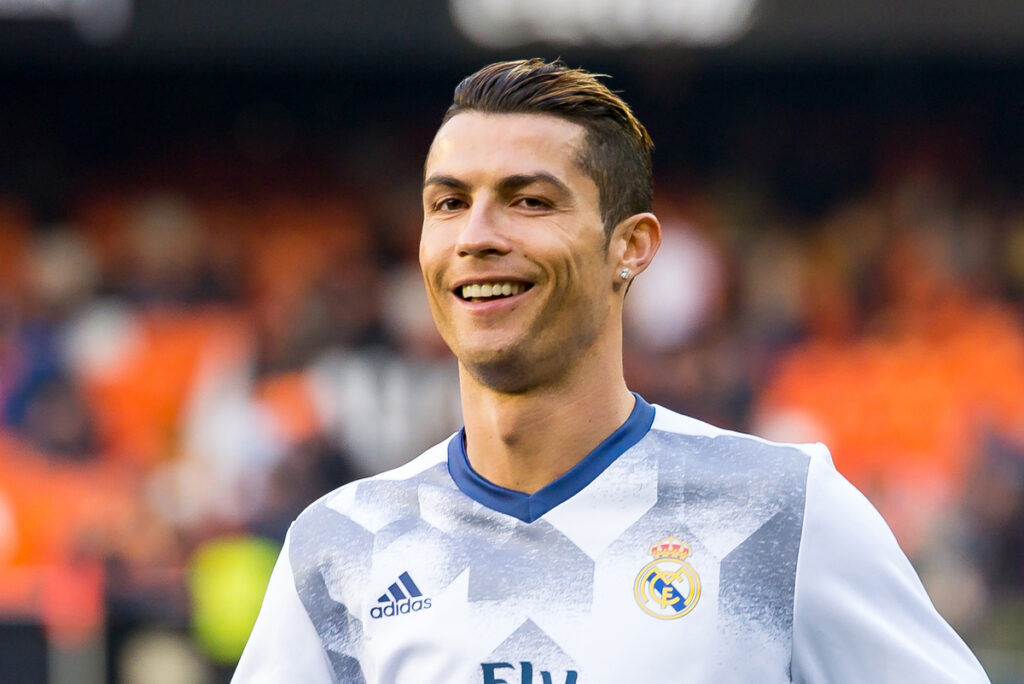 Famous soccer player Cristiano Ronaldo smiling to the camera