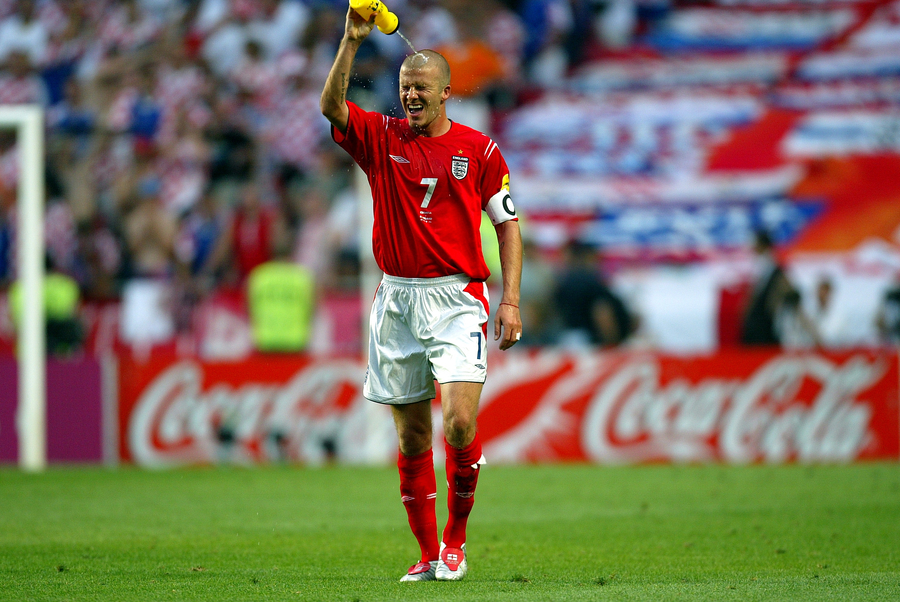 England captain David Beckham cools him self off with some water during the UEFA Euro 2004 Croatia vs England at the Estadio da Luz.