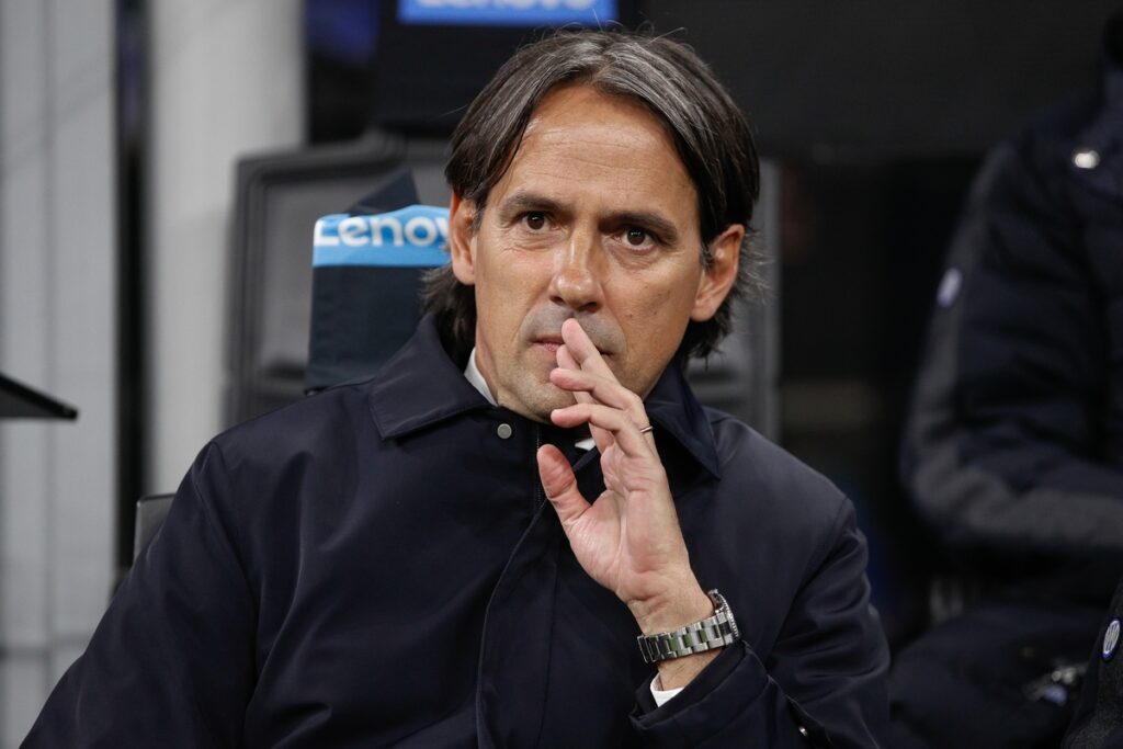 Simone Inzaghi seated in the bench