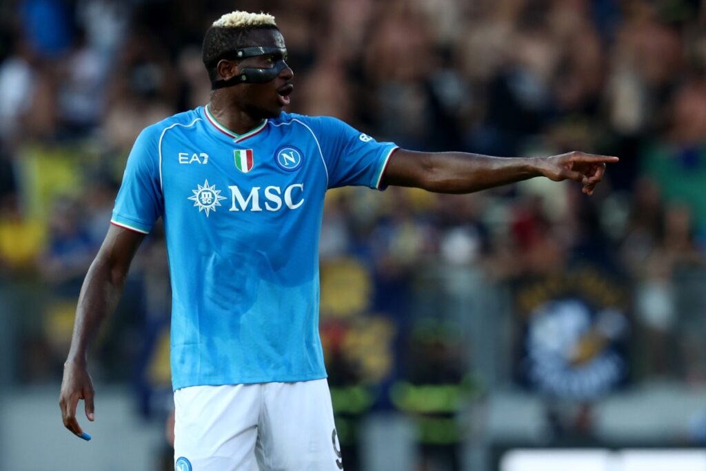 VIctor Osimhen of Napoli pointing off camera in stadium