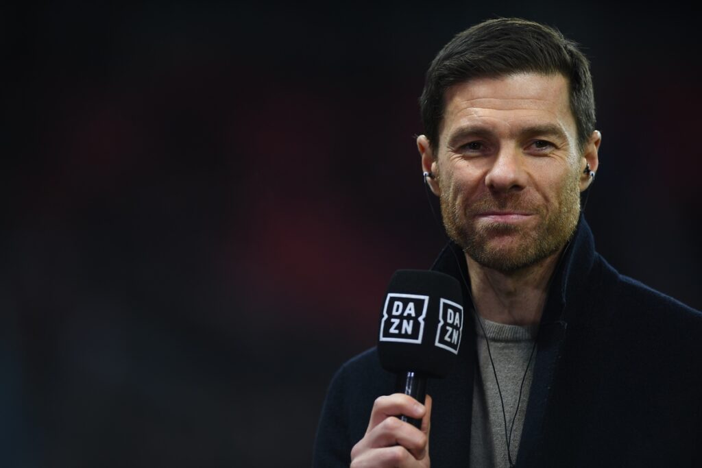 Xabi Alonso holding up a microphone