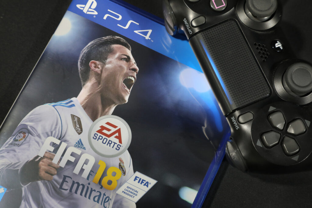 Copy of FIFA 18 with Cristiano Rolando on the cover with PS4 controller