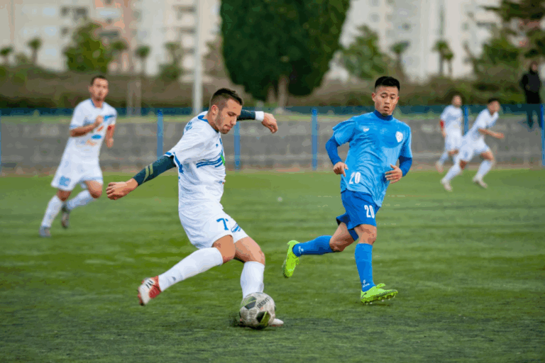 football player kicking the ball