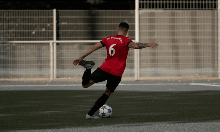 person kicking a ball