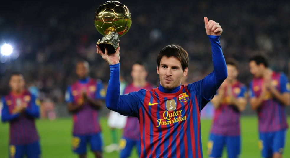 Messi holding the Ballon d'Or award