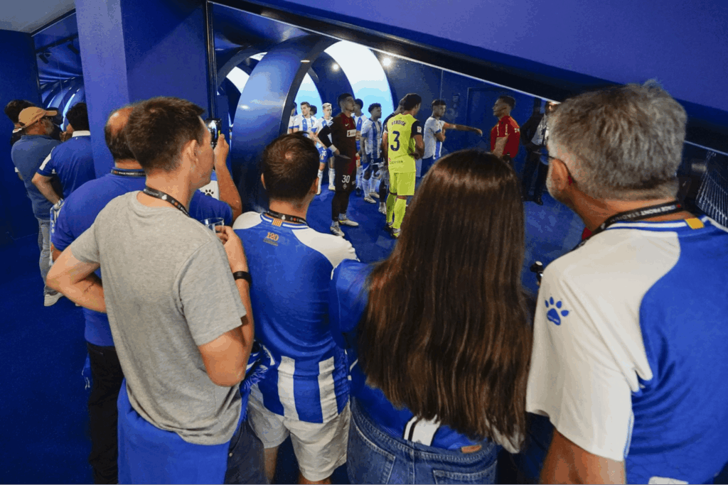 Players crossing the tunnel inside the arena