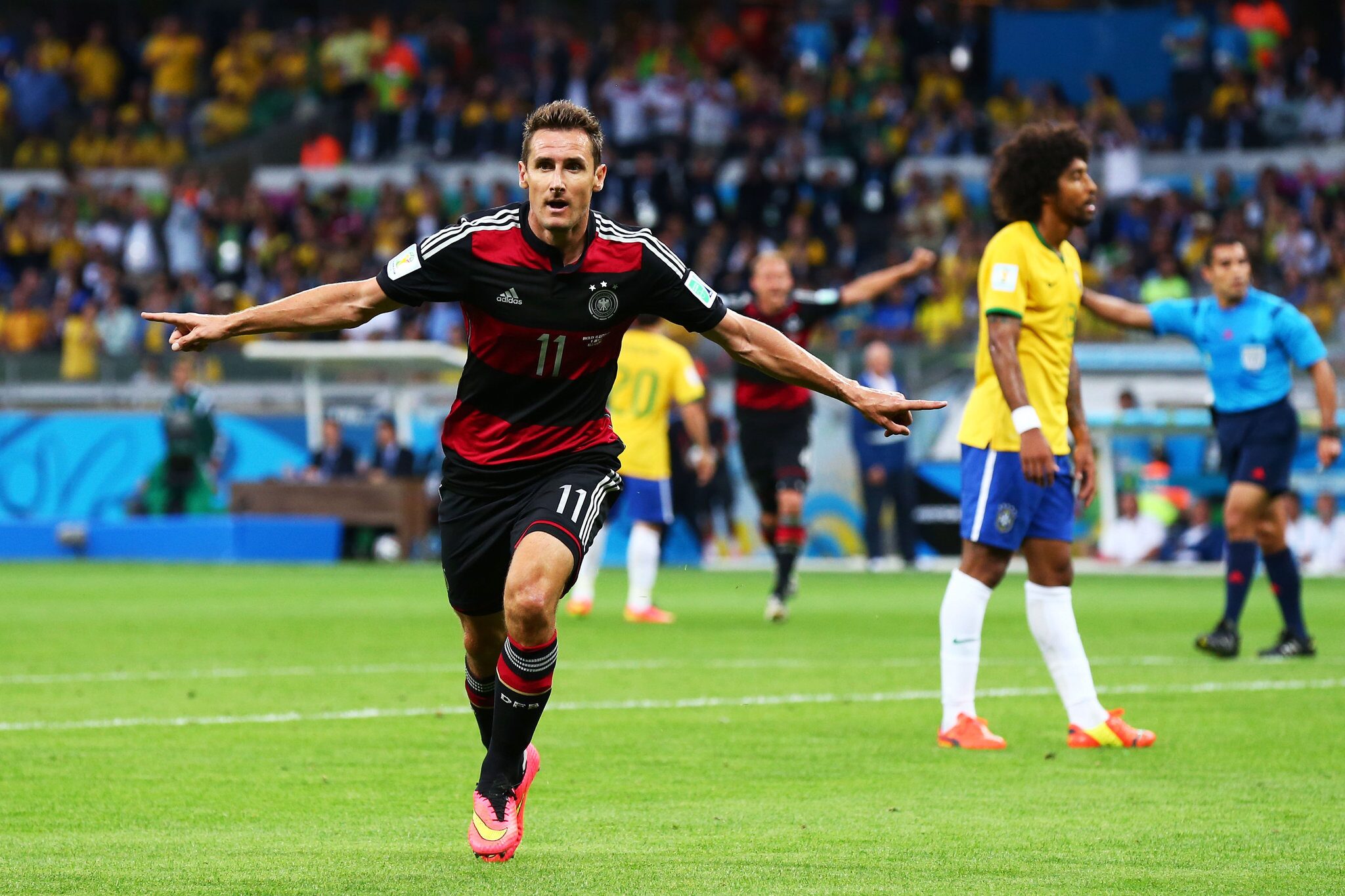 German player celebrating a goal against Brazil in the FIFA World Cup
