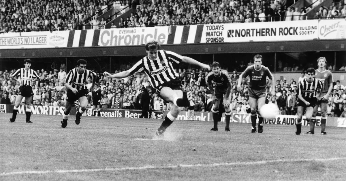 newcastle player kicking the ball