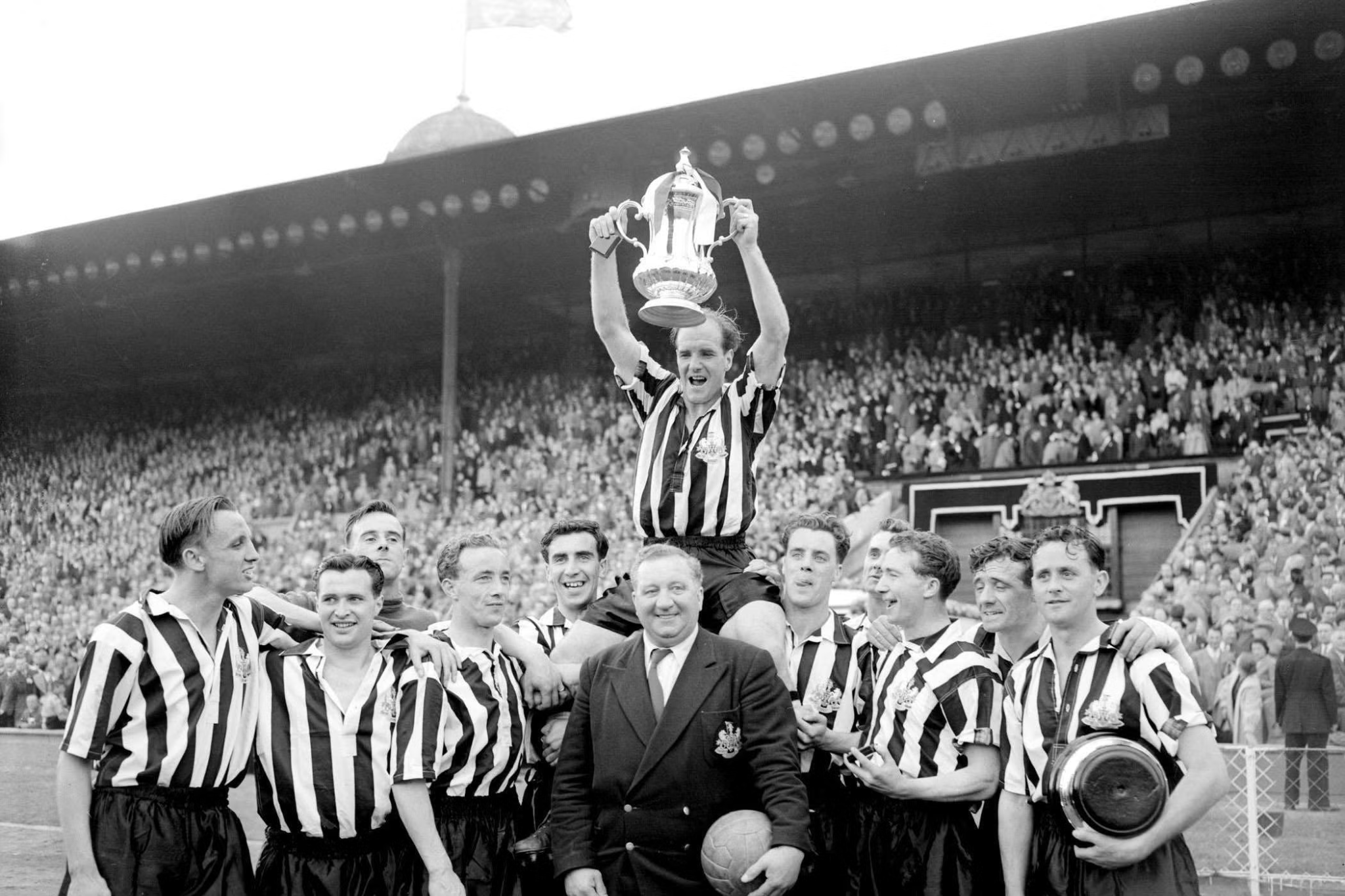 Newcastle United raising a trophy