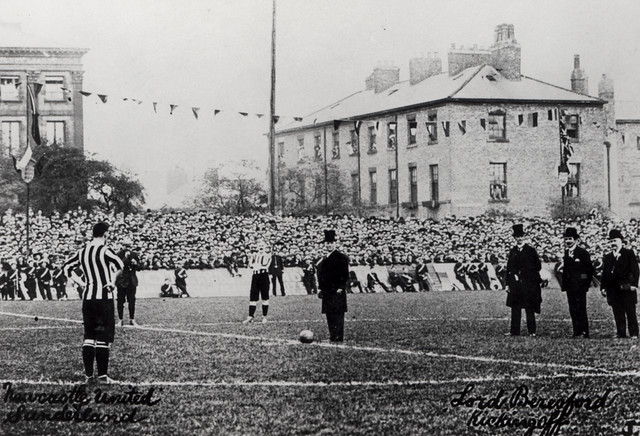 two teams playing a football match during the 1890s