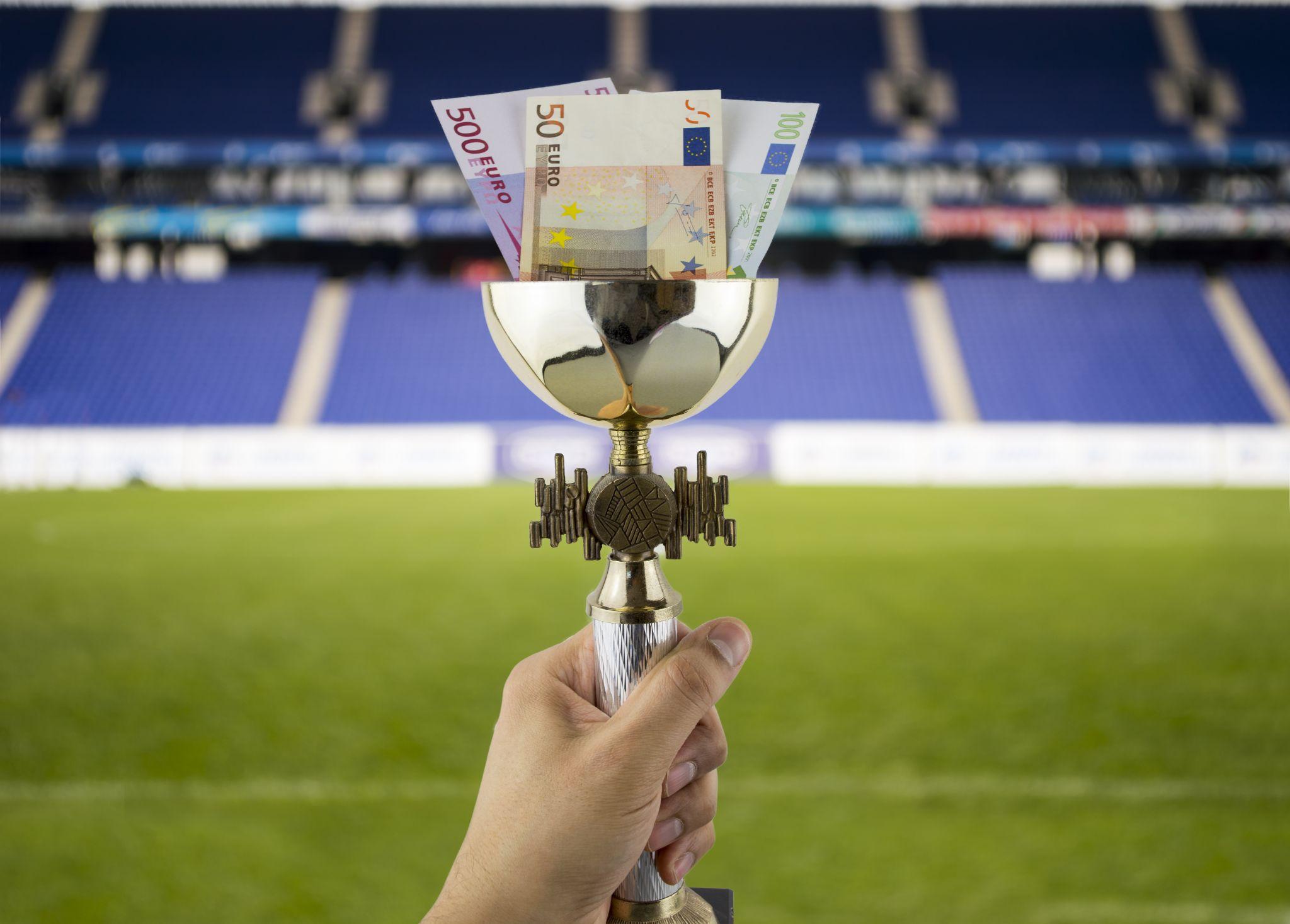 football trophy with euro bills inside