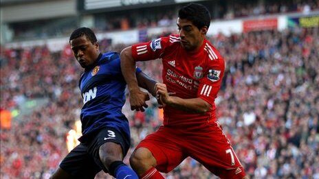 Luis Suarez and Patrice Evra during a football match