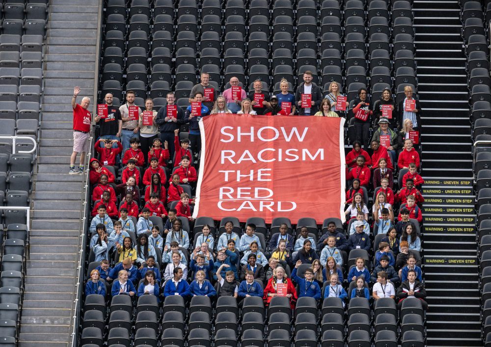 Show Racism the Red Card protesting during a match